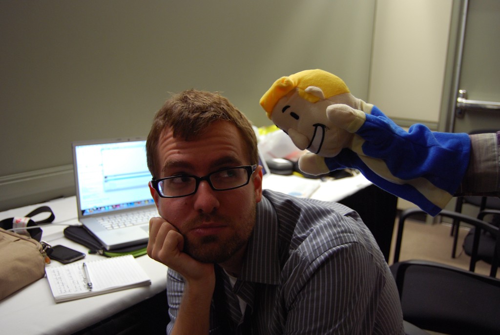 PAX Vault Boy puppet chearing up a weary gaming journalist